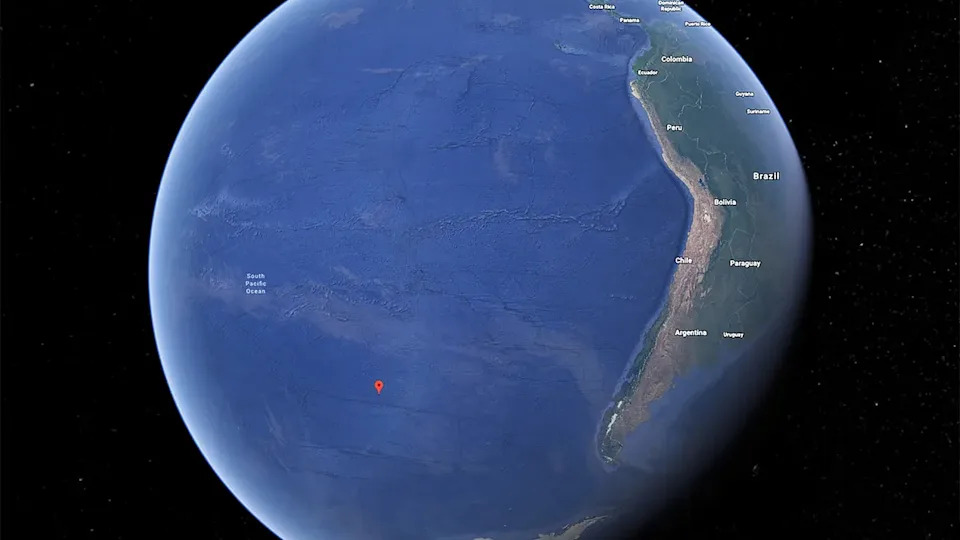 a map of earth with a red marker on a spot west of south america
