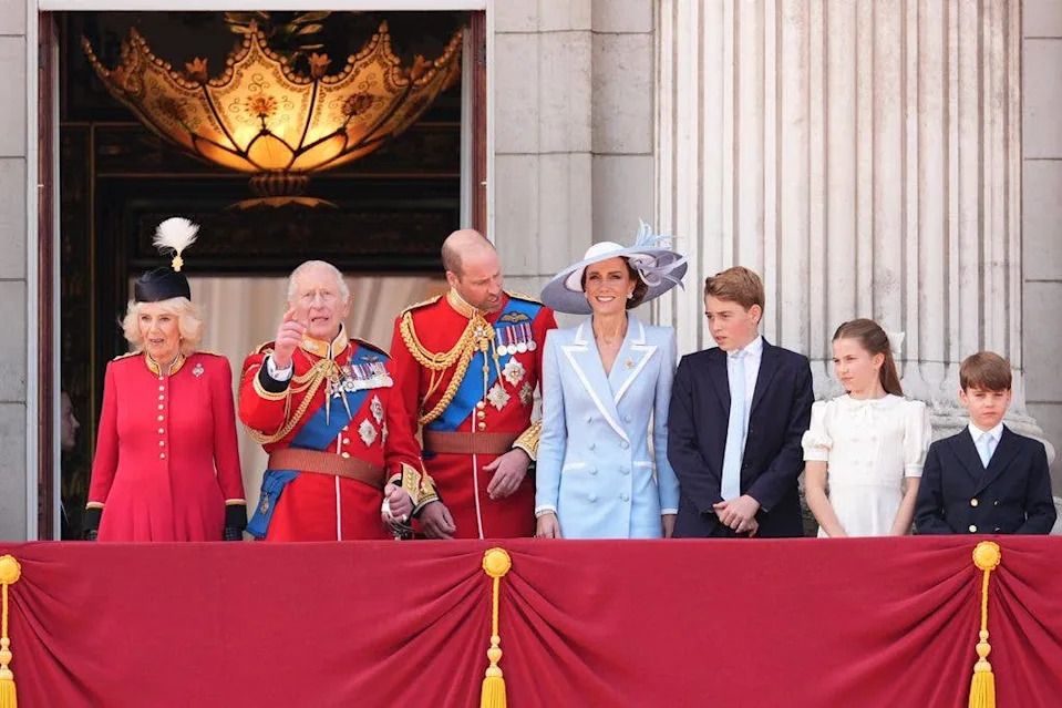 Charlotte initially stood further to the right, before moving closer to her parents