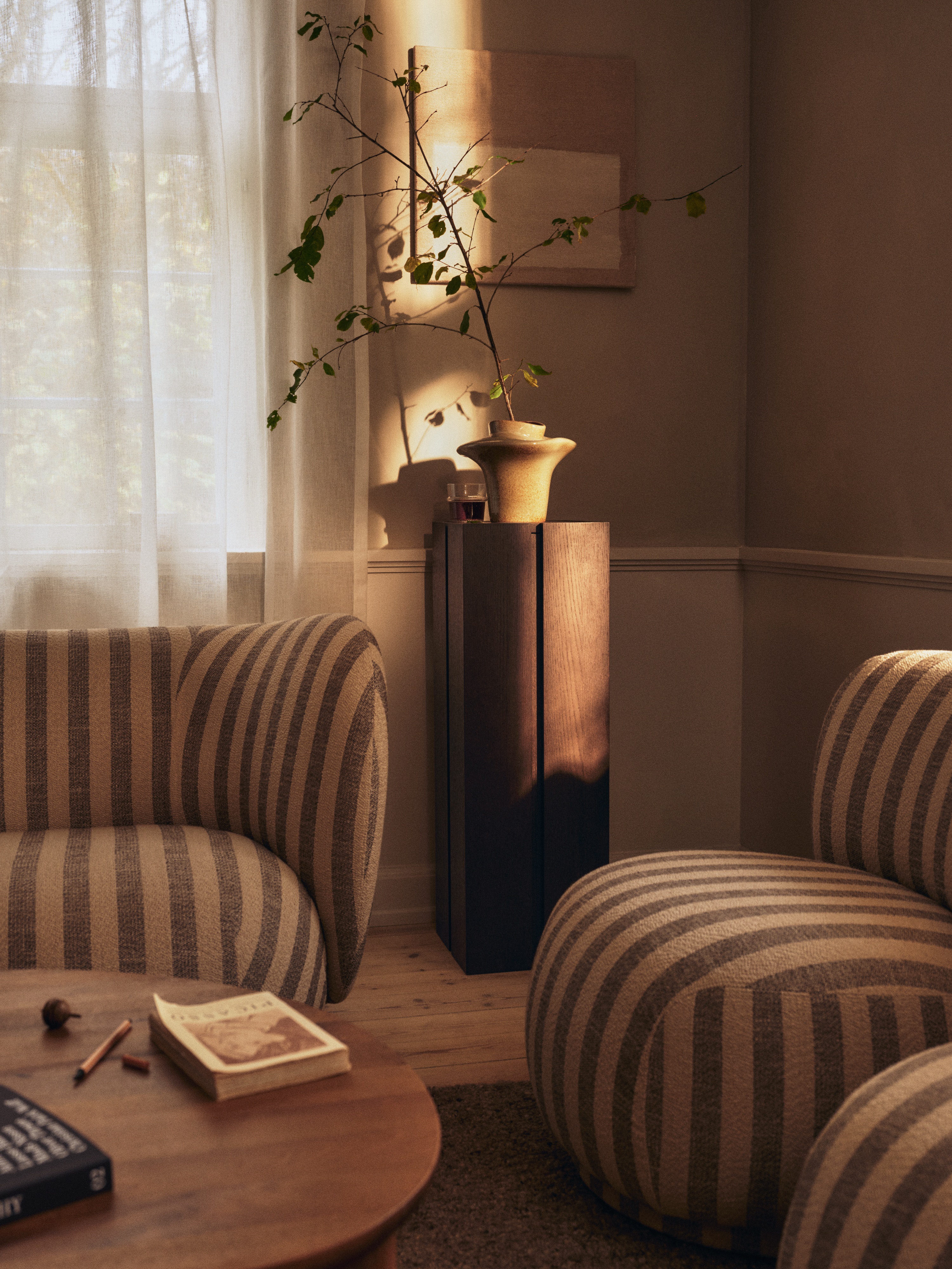 Striped sofa and armchairs in a contemporary Scandi living room