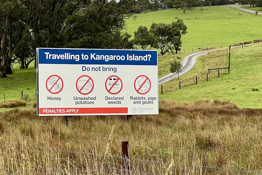A sign advising that travellers cannot bring rabbits, pigs, goats, honey, unwashed potatoes or declared weeds to Kangaroo Island