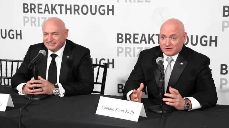 Astronaut Scott Kelly and twin brother Mark at a conference