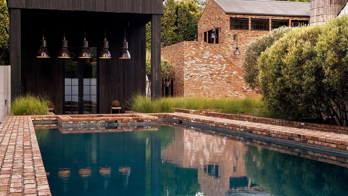 A swimming pool encased in brick
