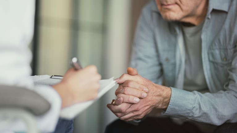 Doctor talks with patient. File photo.