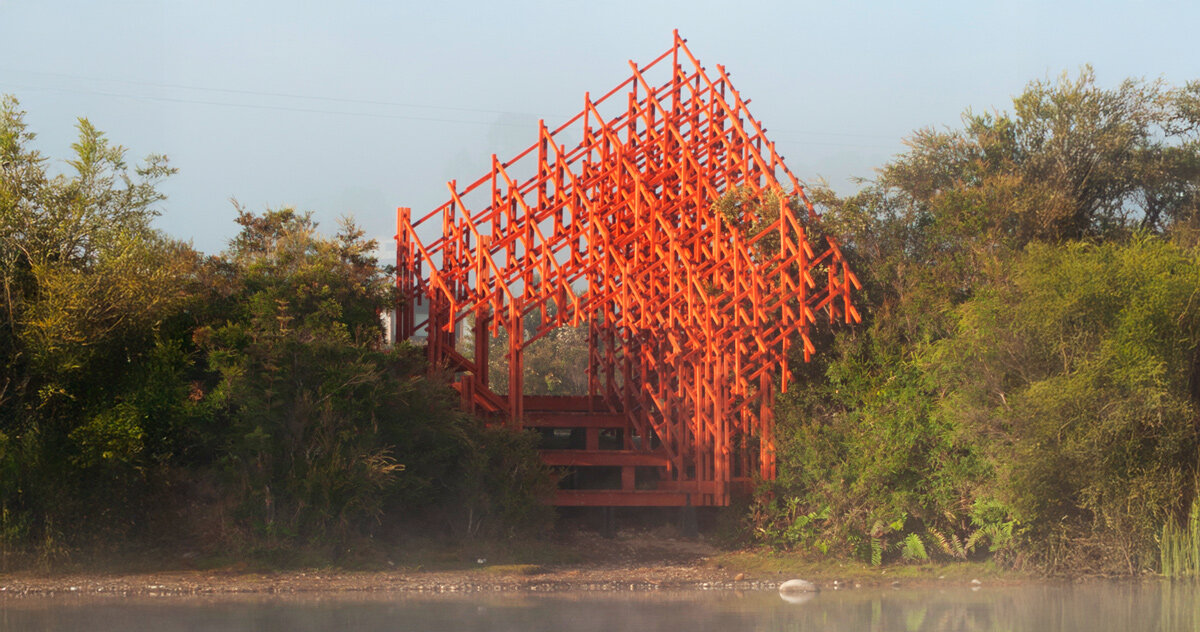 an intricate timber viewpoint by dum-dum lab rises beside chile's laguna troya