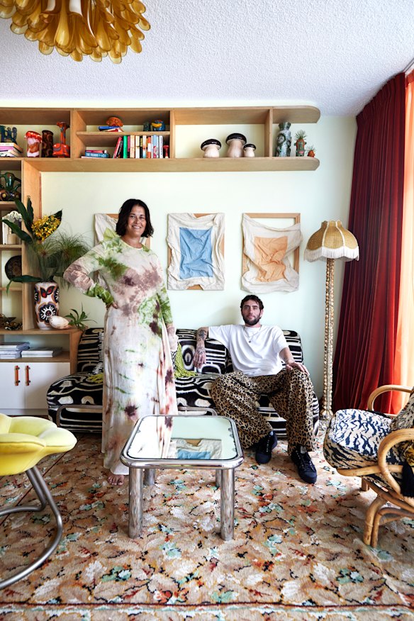 The living room is full of unusual
pieces Britt Ross sourced at home and abroad. The triptych artwork is by Gabrielle Boshier.