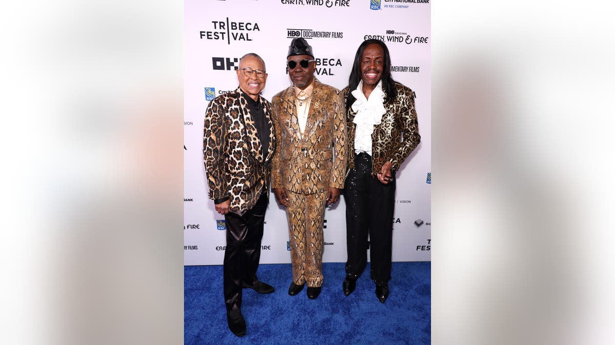 Ralph Johnson, Philip Bailey, and Verdine White standing together at the Beacon Theatre in New York City.