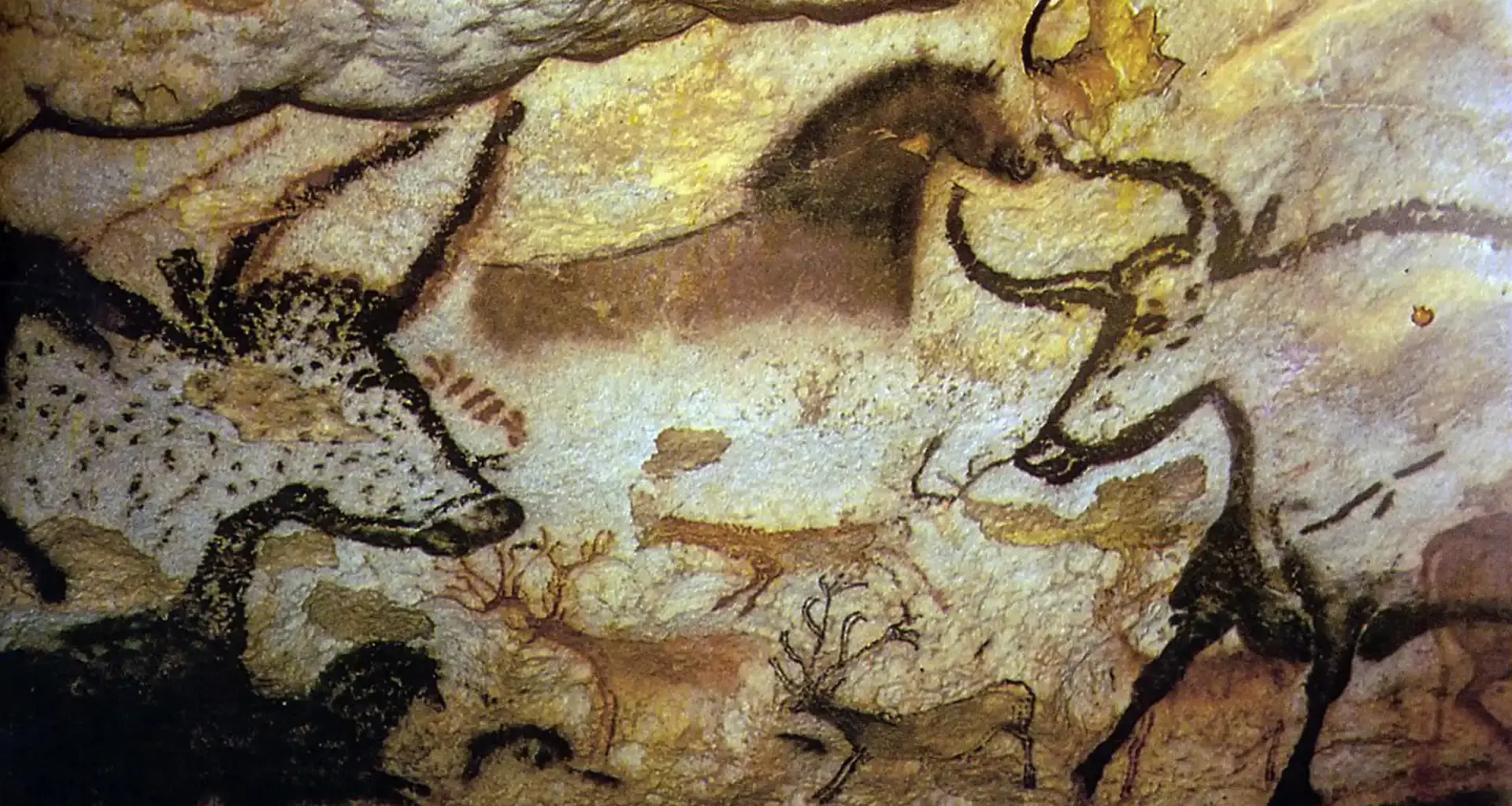 Ancient cave painting depicting bison and other animals.