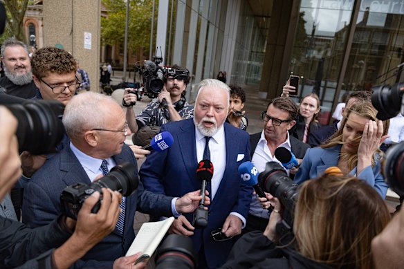 Kyle Sandilands (centre), pictured outside court in April, is on the cusp of settling his dispute with ARN, which was set to drag on in court for months.