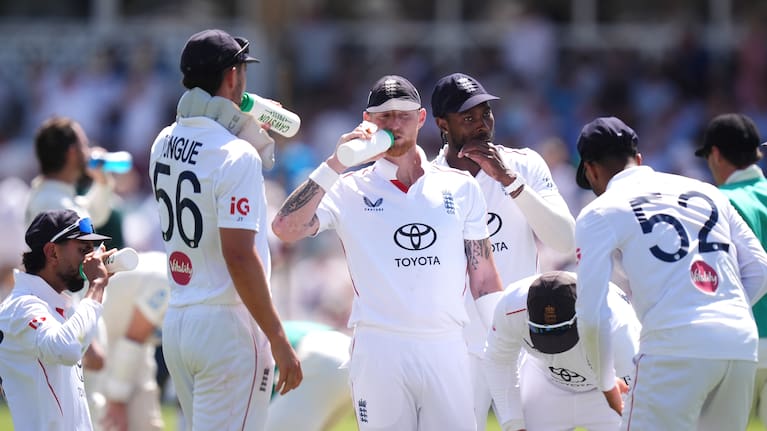 England's Ben Stokes, center and teammates take a drinks break during day one of the Third Test cricket match between England and New Zealand, in Nottingham, England.