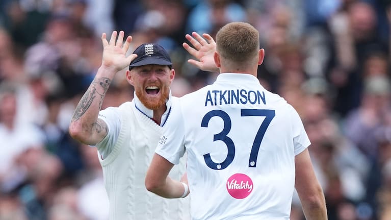England's Gus Atkinson, right, celebrates with captain Ben Stokes after bowling out New Zealand's Matt Henry to win the Test match between England and New Zealand at Lord's cricket ground in London, Sunday, June 7, 2026.