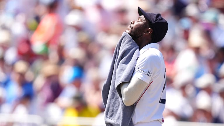 England's Jofra Archer wipes his face with a towel, during day one of the Third Test cricket match between England and New Zealand, in Nottingham.