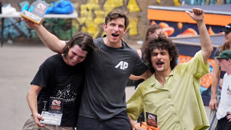 Extreme pogo athlete Michael Mena, center, celebrates his first place win in the Best Trick competition with Henry Cabelus, left, second place, and Dalton Smith, third place at Pogopalooza 2026.