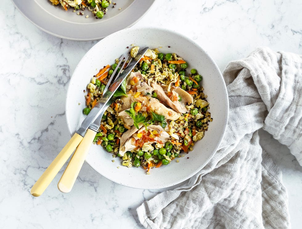 bowl of quinoa salad with chicken and vegetables