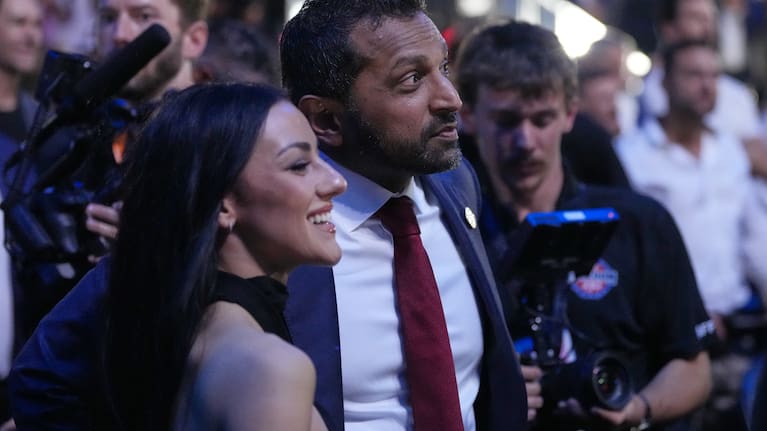 FBI director Kash Patel watches with Alexis Wilkins at UFC Freedom 250 on the South Lawn of the White House, Monday, June 15, 2026, in Washington.