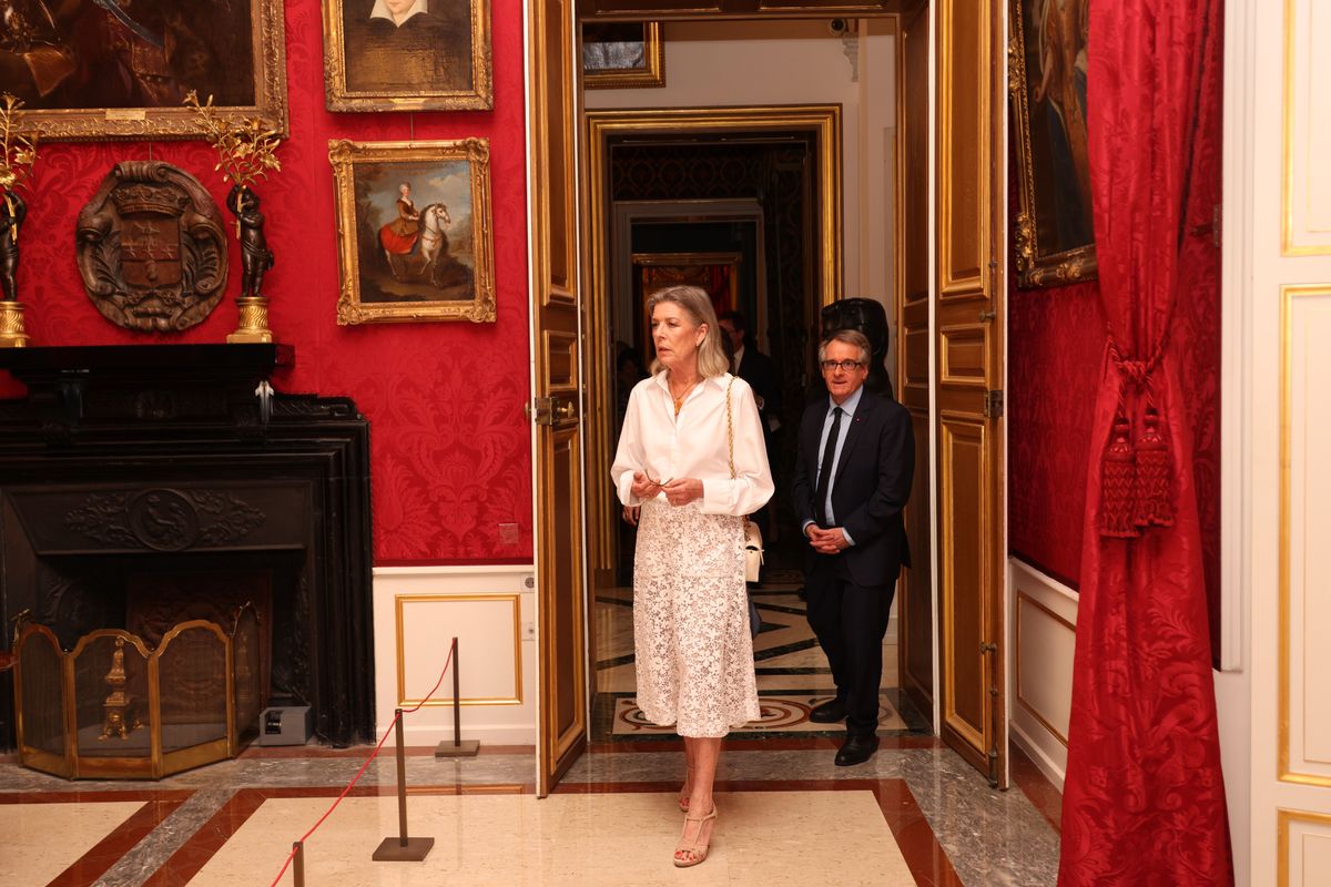 The princess completed her sophisticated monochromatic look with nude heels and a classic white quilted Chanel handbag.