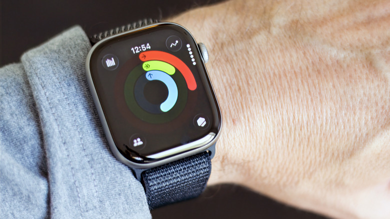 Closeup of an Apple Watch, with activity rings progress showing