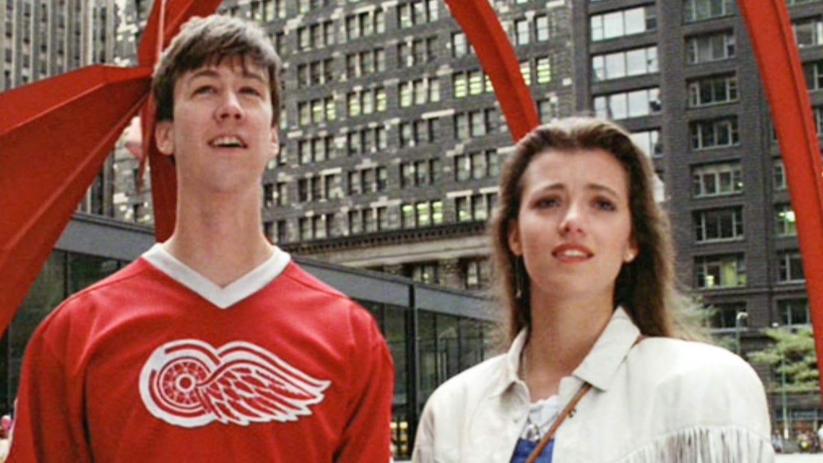 Alan Ruck as Cameron Frye and Mia Sara as Sloane Peterson in Ferris Bueller's Day Off movie scene.
