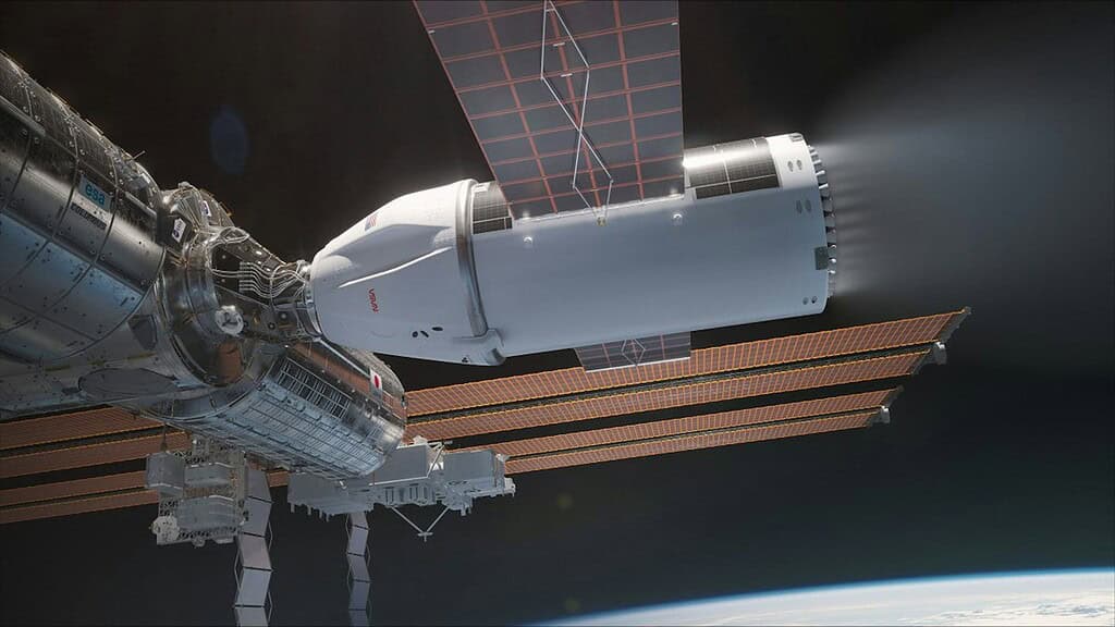 Space station orbiting Earth with solar panels and Earth in background.