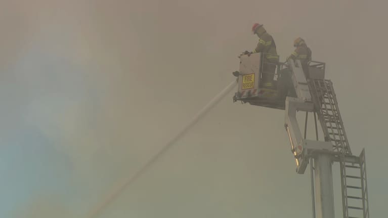 Firefighters work to control the blaze at the New World at Victoria Park in Auckland.