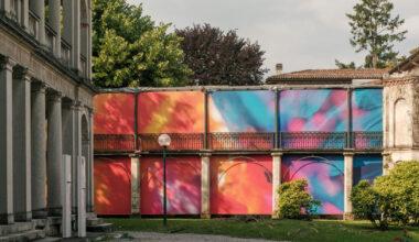colorful textile installation reimagines historic laundry building in switzerland