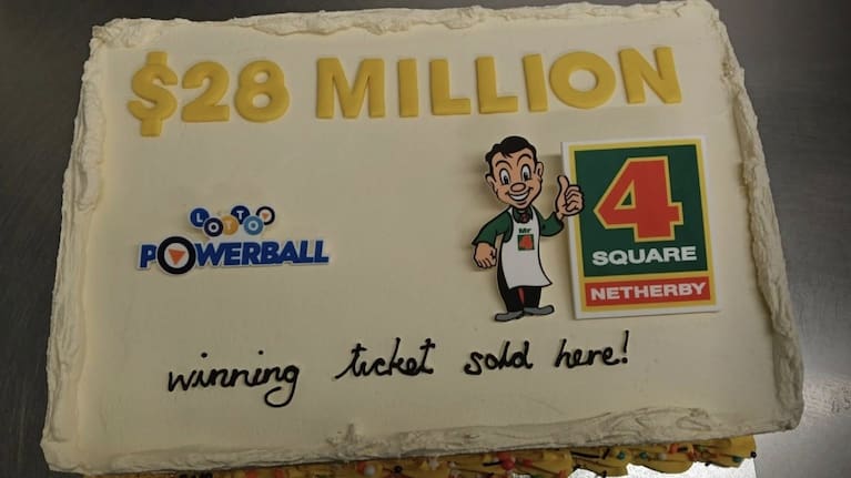 Four Square Netherby in Ashburton celebrate a $28m Lotto ticket sold with cake.