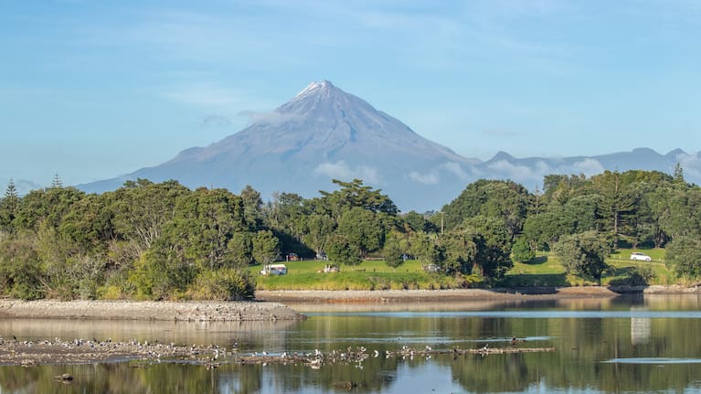 A freedom camping site in New Plymouth with Mt Taranaki in the background.