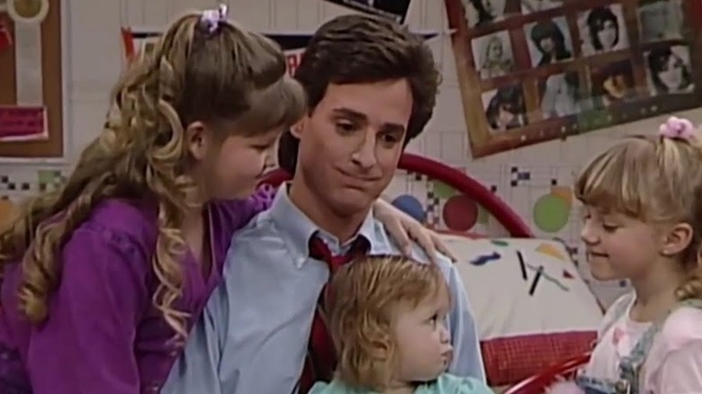 Bob Saget as Danny Tanner, talking to his children in a bedroom in Full House.