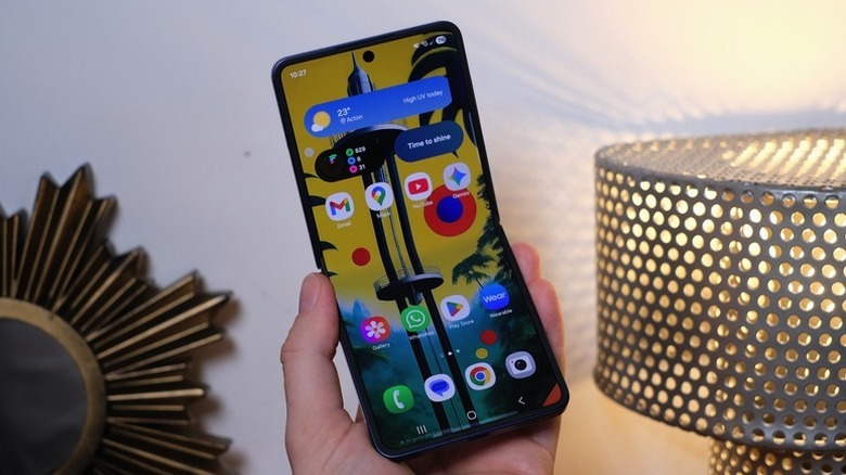 The Samsung Galaxy Z Flip 7, mostly unfolded and in hand