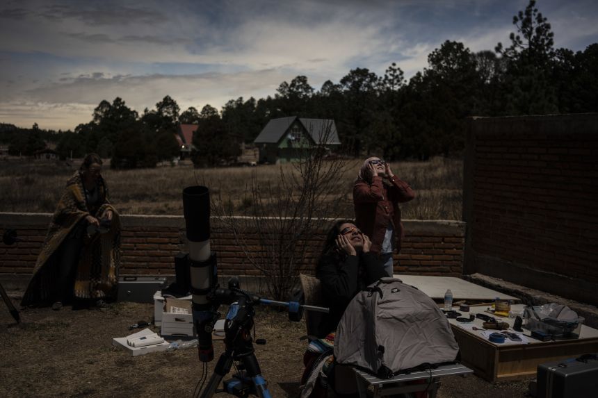 Researchers watch the total solar eclipse in Mexico on April 8, 2026.