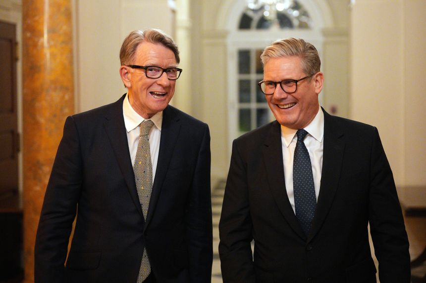 Outgoing UK Prime Minister Keir Starmer talks with Britain's former ambassador to the United States, Peter Mandelson (L), during a reception at the ambassador's residence on February 26, 2025 in Washington, DC.