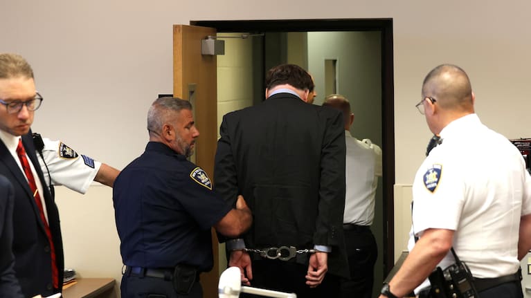 Gilgo Serial Killer Rex Heuermann is escorted away after being sentenced by Judge Timothy Mazzei at Suffolk County Court.