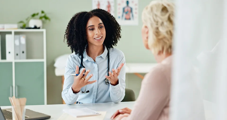 Doctor discussing GLP-1 medication and dosing with a patient during an office visit