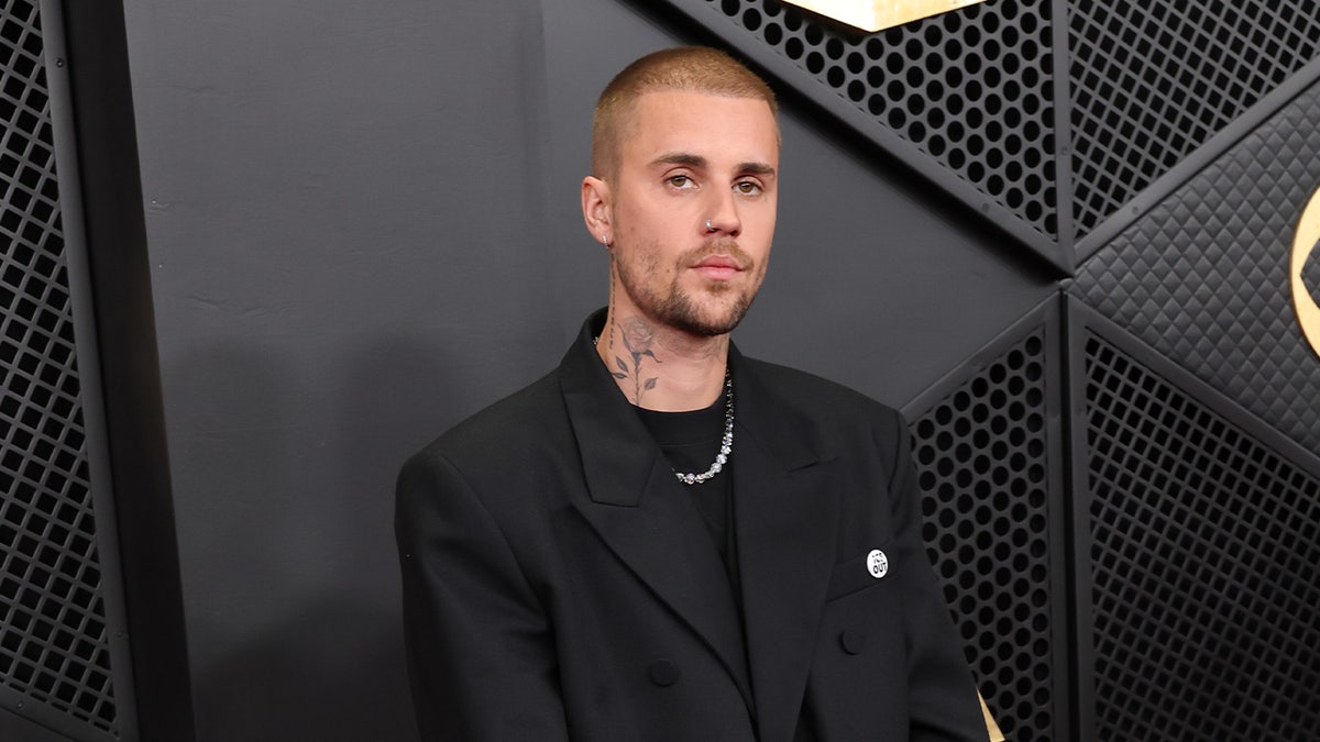 Justin Bieber walking on the red carpet at the Grammy Awards in Los Angeles