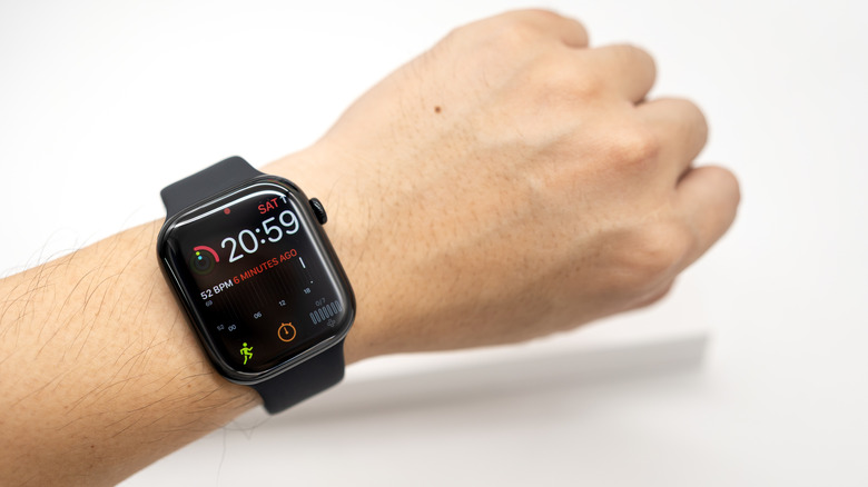 Close-up of a person wearing an Apple Watch Series 11 on their wrist