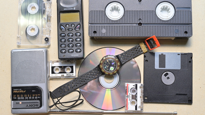 A variety of 1990s tech laid out on a table