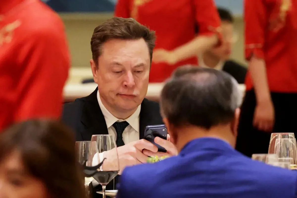 TSLA, SPCX Slip Overnight: Elon Musk Warns AI Production Shortfall Is ‘Insane’ As Apple Price Shock Hits Tech
