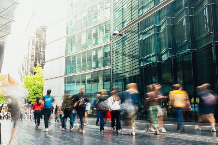People walking in blurred motion in a modern downtown street
