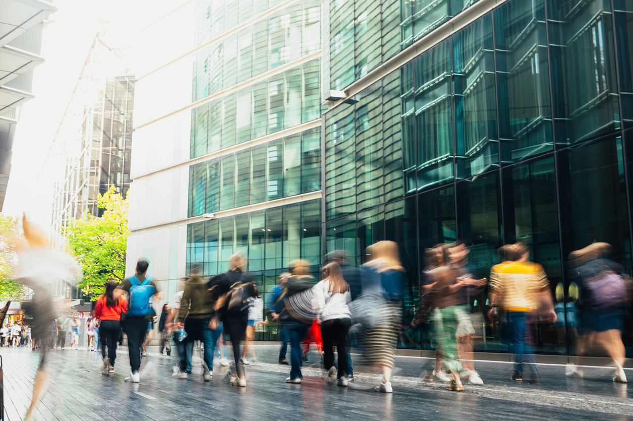 People walking in blurred motion in a modern downtown street