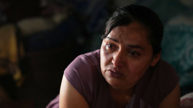Mirsy Maricela Alva Lopez, a Guatemalan migrant who has been separated from her son Ederson twice, cries during an interview at her parents' house in San Martín Cuchumatán