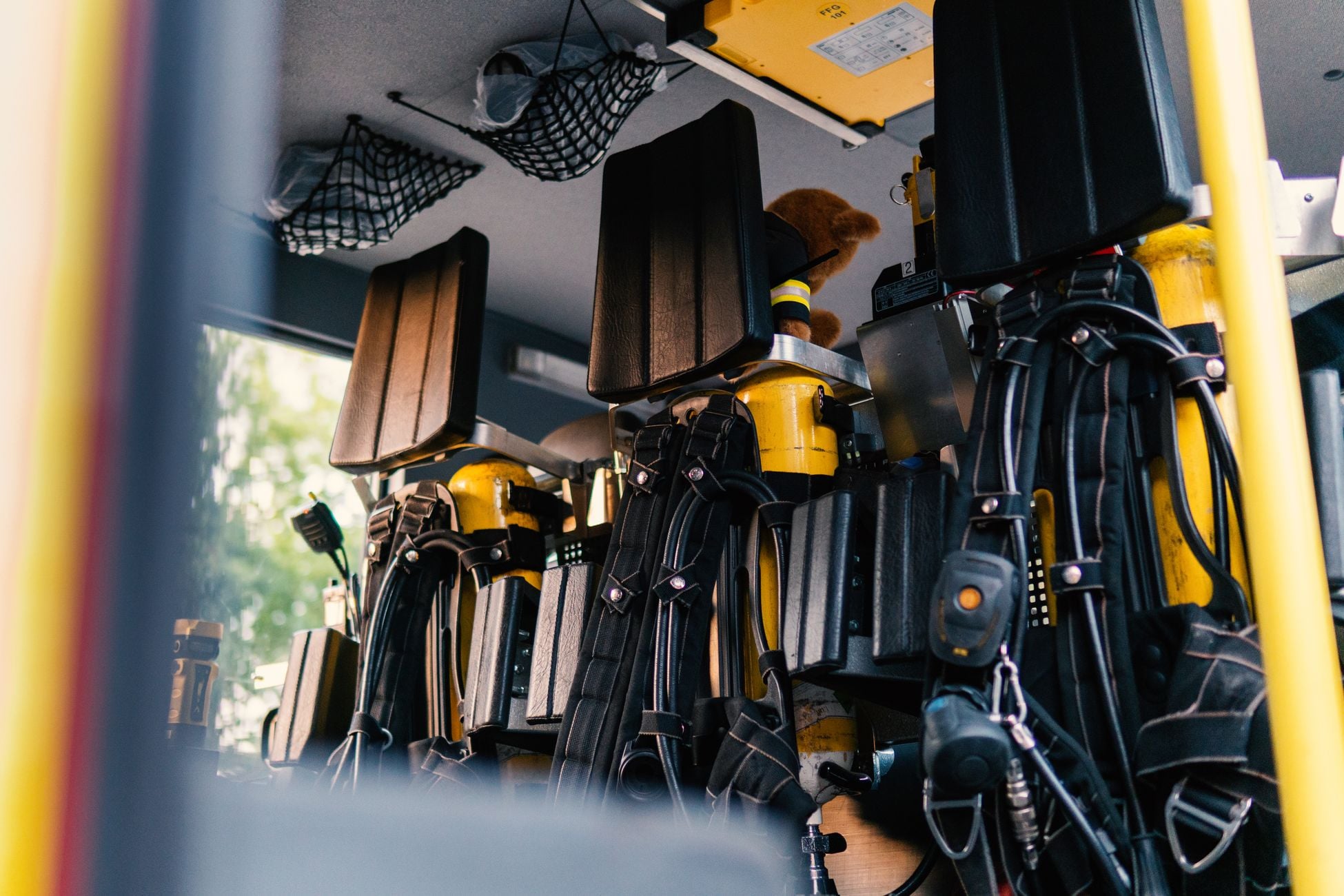 Interior view of a firetruck highlighting essential rescue equipment and oxygen tanks.