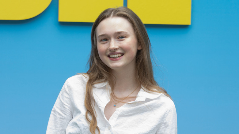 India Fowler in white blouse smiling