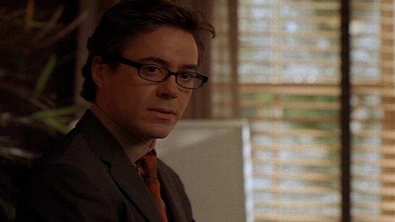 Larry wearing glasses in an office in Ally McBeal (1997)