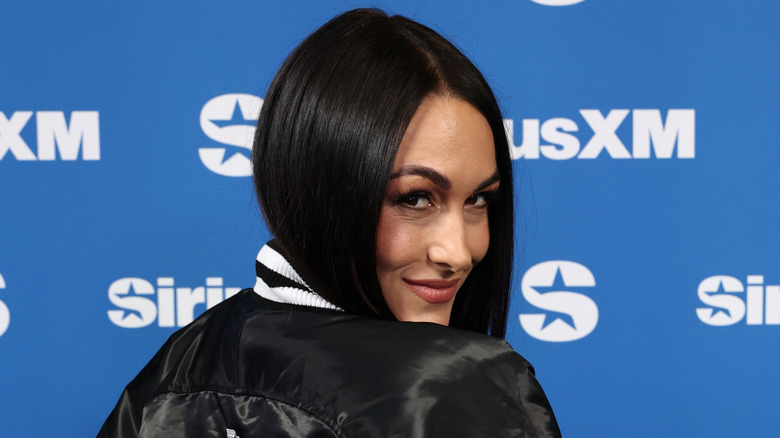 Brie Bella poses for a photo at SiriusXM on Radio Row at Super Bowl LX