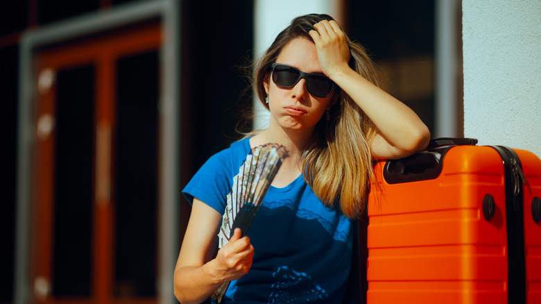 Traveler sweating on vacation