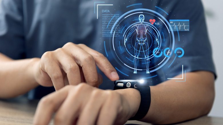 Close-up of a person using a smartwatch with a graphic indicating health data