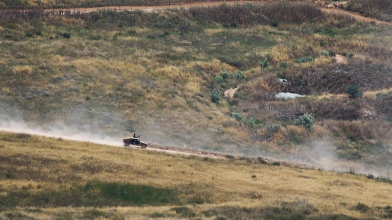 Israeli soldiers drive in southern Lebanon as seen from northern Israel, Thursday June 4, 2026.