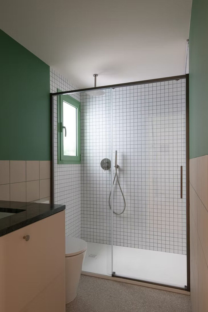 NOT A STUDIO uses color-coded structure to open up century-old barcelona apartment - 16