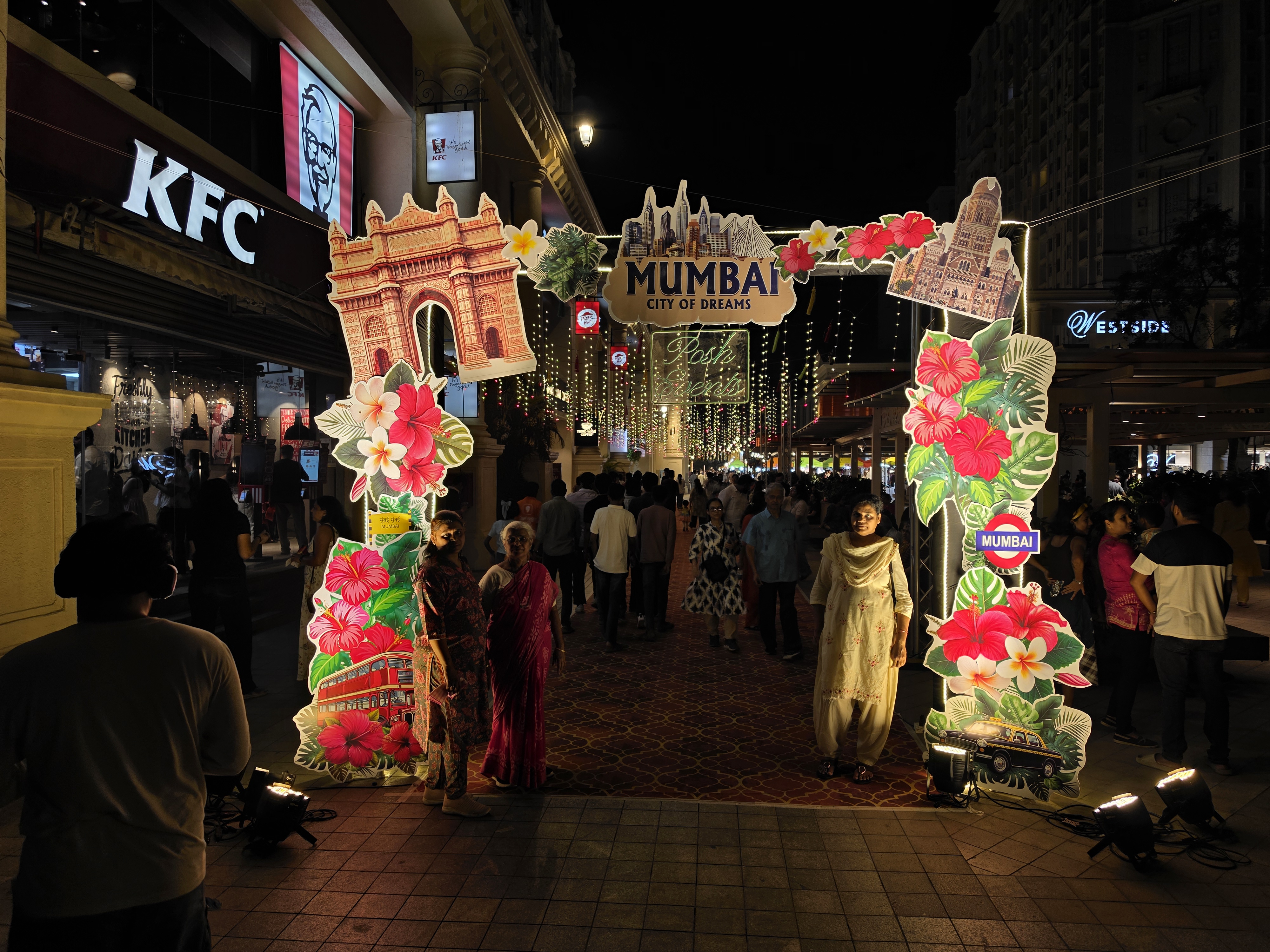 A Mumbai festival entrance at night.