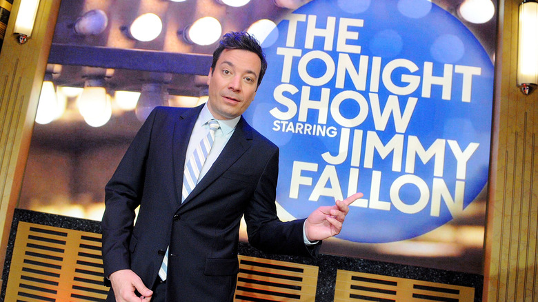 Jimmy Fallon posing in front of a Tonight Show Starring Jimmy Fallon sign (2017)