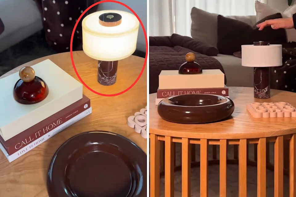 The brown Kmart lamp on coffee table among other items. 